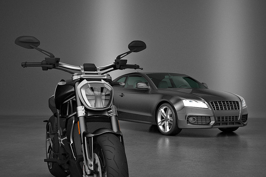 Old and New motorbikes on dark background